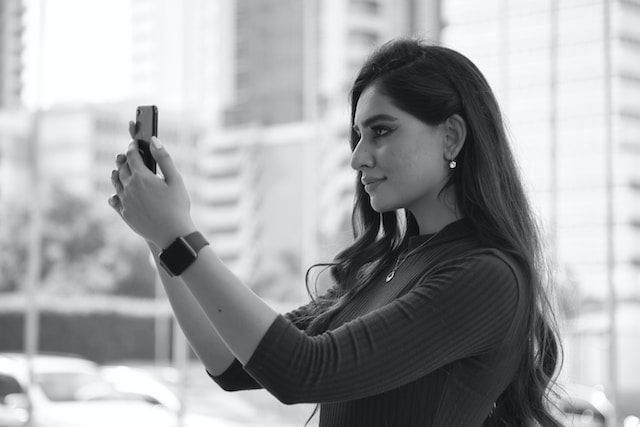 woman taking a selfie without fear of being judged on social media