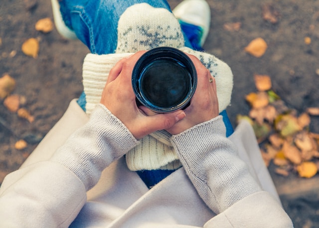 drinking coffee outside in autumn - self-care idea